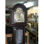 A Mahogany long case clock with three visible weig