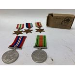 A collection of five second world war medals, thre