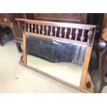 An Oak overmantel mirror dimensions- 125x74 approx