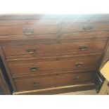 An Edwardian walnut chest of drawers fitted with t