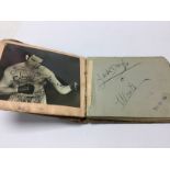 A autograph book containing boxing and speedway au