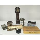 A small table top long case clock a carriage clock