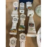 A collection of crested ware long case clocks.