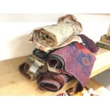 A collection of vintage rugs in various sizes and