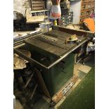 Two electric table saws with numerous cutting blades steel top beds and finished in green (2)