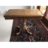 A William VI rosewood card table the hinged top on