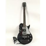 An Encore electric guitar in Les Paul shape with s