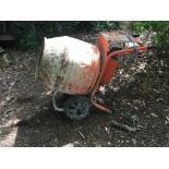 An electric free standing cement mixer.