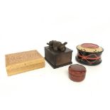 A novelty carved wood dog cigarette dispenser and