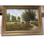 A framed oil painting of a rural view and cattle.