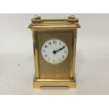 A brass case carriage clock the circular With Arab