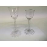 Two 18th Century wine glasses one with an air twis