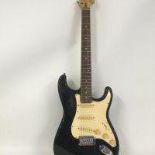 A Stratocaster style electric guitar with Eric Cla
