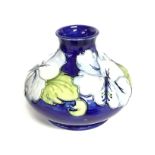 Small Moorcroft vase decorated with lilies, approx