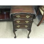 A three draw mahogany chest with drop leaf top. Ap