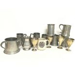 A collection of Pewter tankards, including a ceram