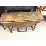 A 19 century oak drop leaf table. 102 x 72 x 85 cm