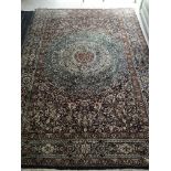 A hand knotted Persian rug with a profuse folate p