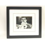 A framed and signed print of Ayrton Senna with COA