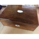 A rosewood sewing box .