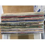 A box of LPs by various artists including Elvis Pr