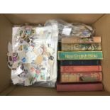 A box of stamps, books, coin set etc. Shipping cat