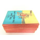 A collection of Vintage Tintin books , postage cat