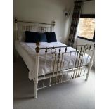 A Victorian brass and painted metal bed with ceram
