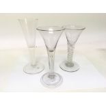 Two 18th century drinking glasses on with an air t