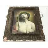 A religious print in a gesso frame. 44 x 50 cm. NO