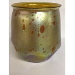 A Loetz iridescent yellow glass vase with dimpled