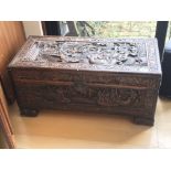 A Carved Camphor wood chest with a hinged rectangu