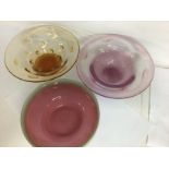 Three art glass bowls in colours of green and pink