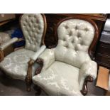 Two Victorian mahogany open arm chairs with button