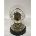 A Kundo German Electric magnetic brass clock with