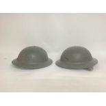 Military issue helmets , postage cat c