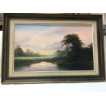 A framed oil painting of a landscape over a river