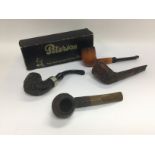 Four vintage pipes comprising a Peterson example,