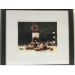 A framed and signed Muhammed Ali print with COA, a