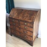 A George II 18th Century walnut bureau with a fall