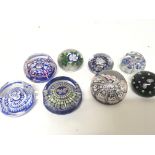 A collection of eight paperweights with insects fl