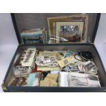 A vintage suitcase containing various ephemera inc