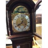 A mahogany grandmother clock the silvered dial wit