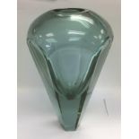 A large and heavy facet cut glass vase, approx hei