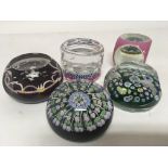 Five Millefiori glass paperweights four with facet