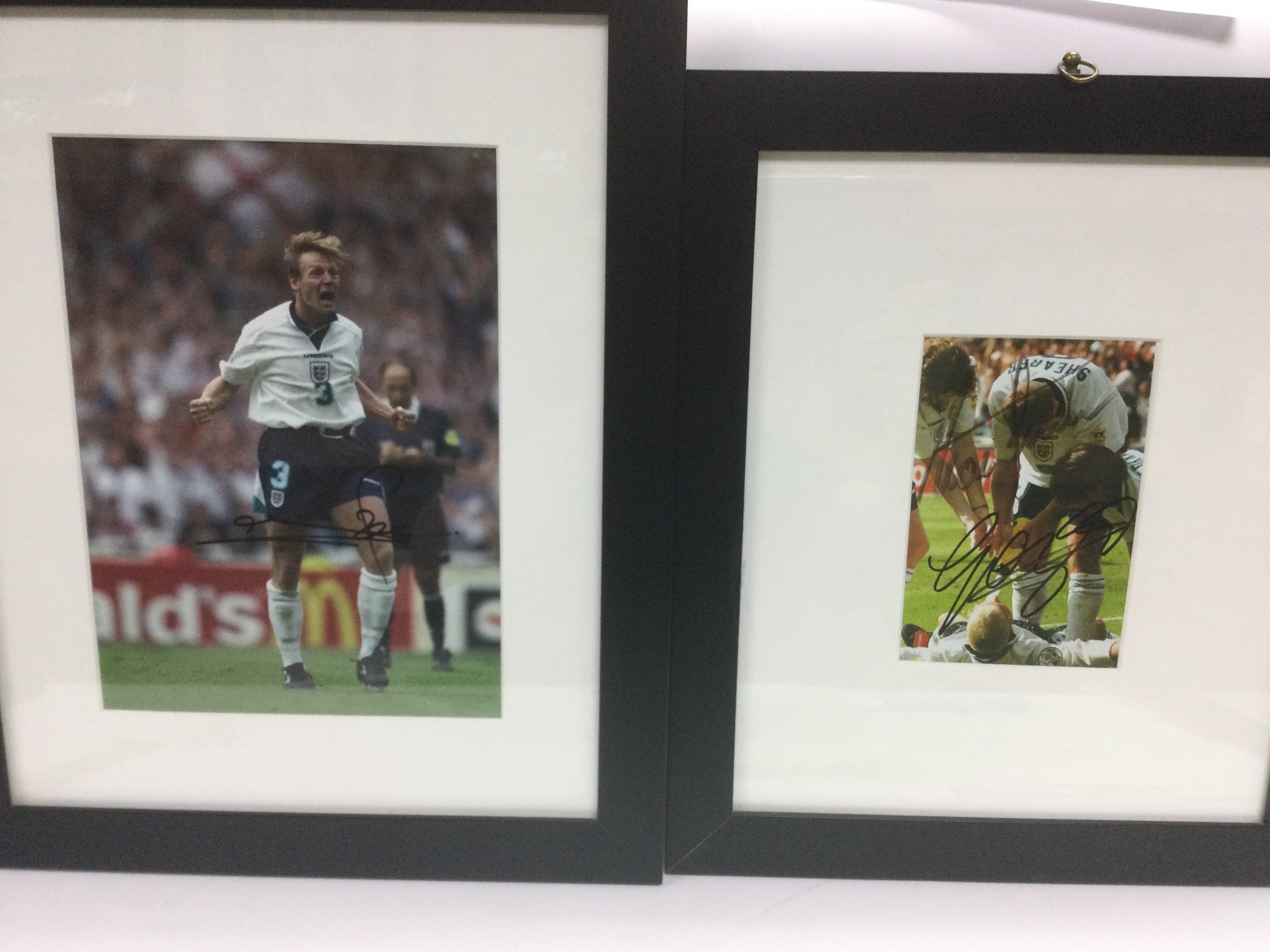 Two framed and signed prints of England footballer