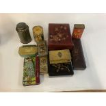 A collection of lacquer boxes and tins.