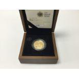 A royal mint 1/4 ounce Britannia gold proof coin.