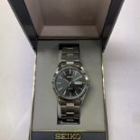 A gents solar powered seiko watch.