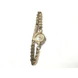 A vintage ladies rolled gold wristwatch. 11.93g. N